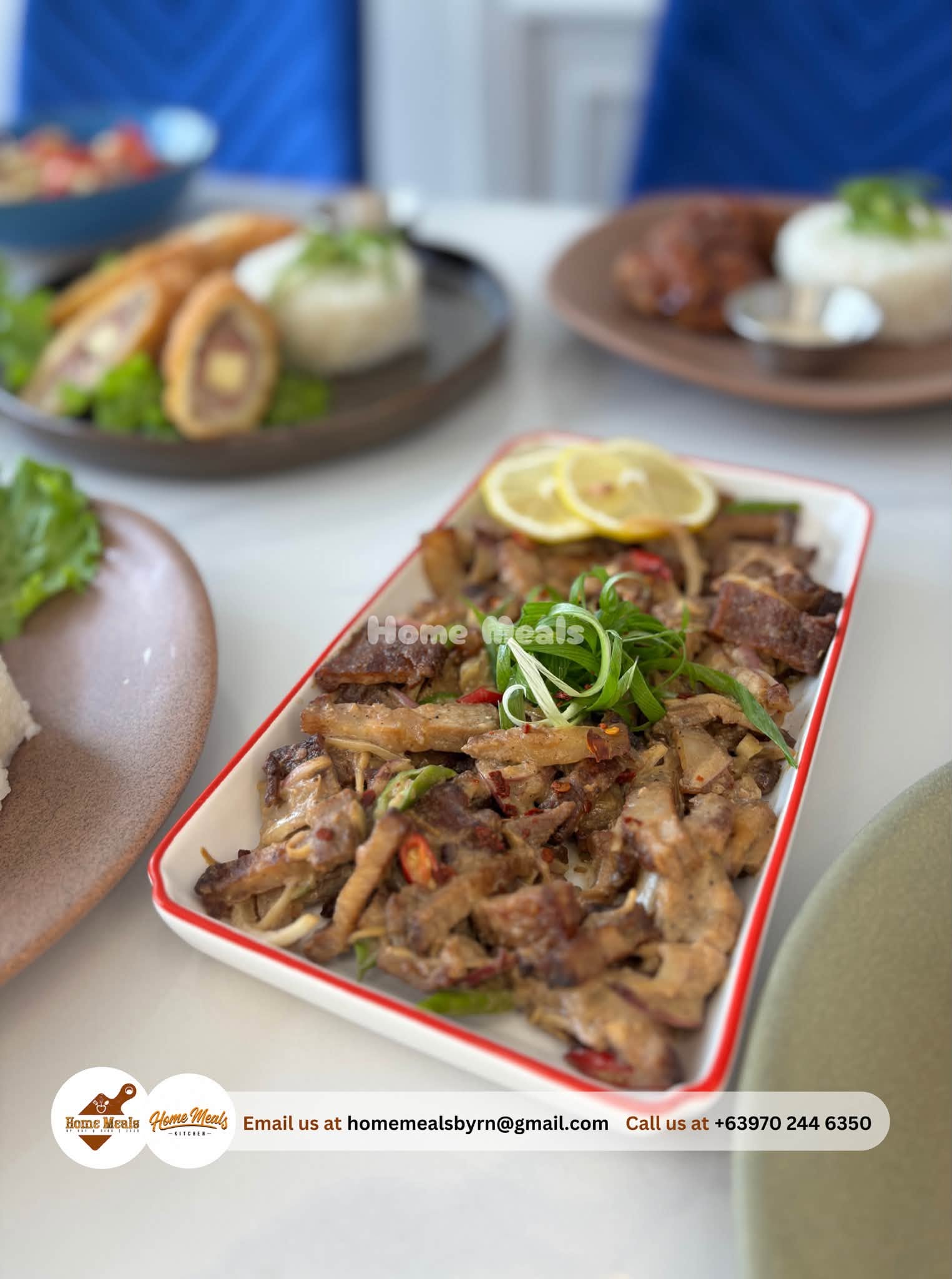 Pork Dinakdakan topped with scallions, chili, and calamansi