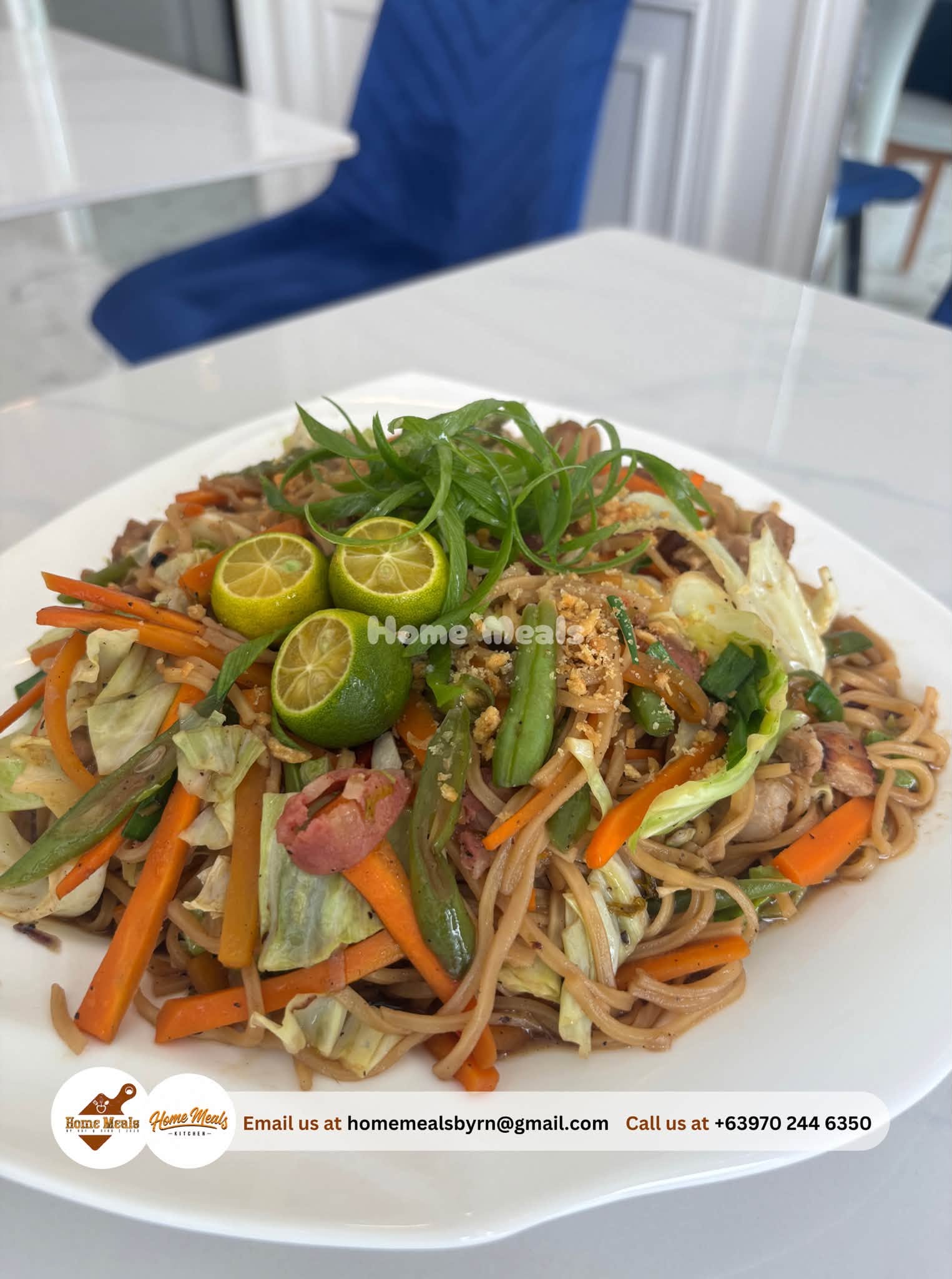 Canton Guisado noodles tossed with vegetables and served with calamansi