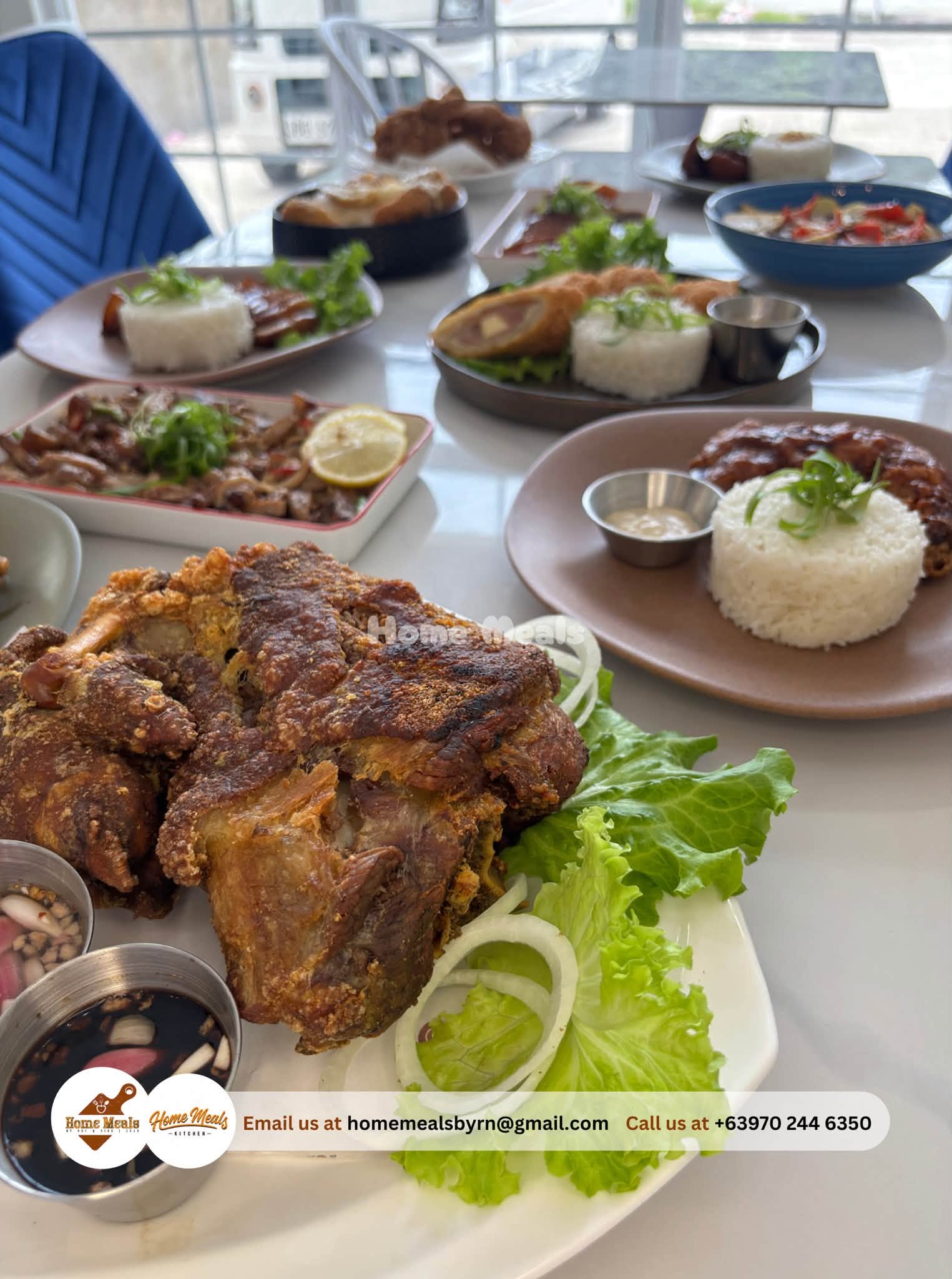 Crispy Pata served with lettuce, onion rings, and spiced vinegar